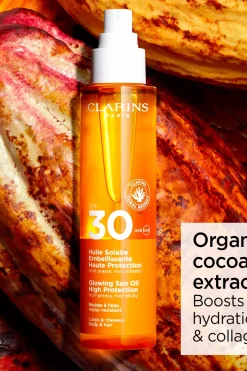 Clarins Aurinkotuotteet<Glowing Sun Oil SPF 30 for body & hair aurinkosuojaöljy 150 ml